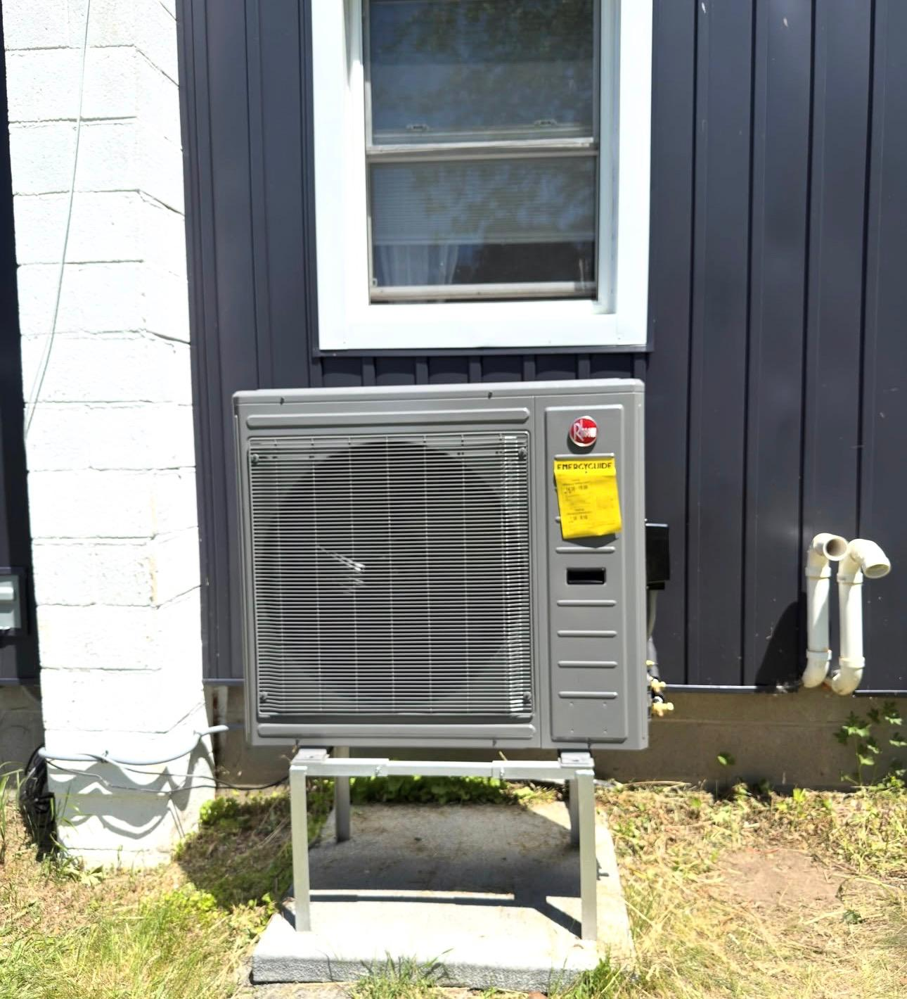 Cold-climate heat pump installed on a raised stand