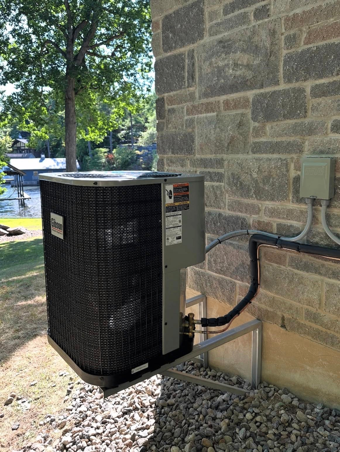 Outdoor condenser installation by Downtown Toronto HVAC